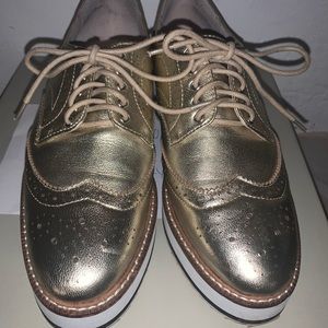 Shellys London shiny gold platform oxfords.